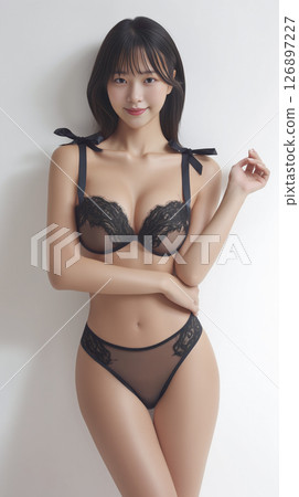 Woman is wearing a black lace bra and panties 126897227