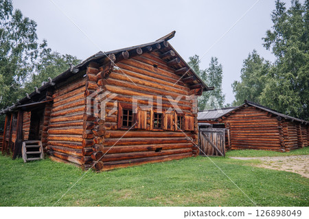 Log cabin showcasing russian rural architecture in a historical setting, preserving cultural heritage amidst nature Log cabin showcasing russian rural architecture in a historical setting, preserving cultural heritage amidst nature 126898049