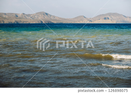 Seascape with mountains on the horizon in Crimea 126898075