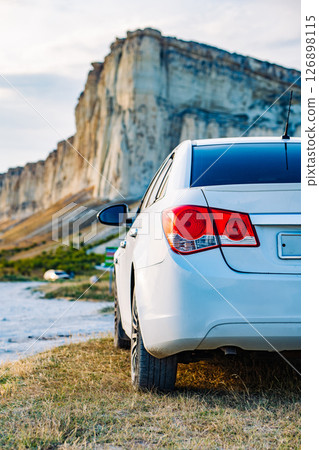 White car parked near White Rock mountain in Crimea 126898115