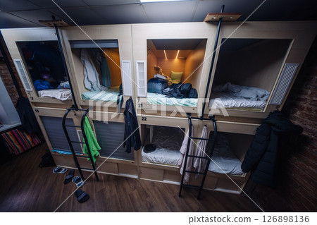 Capsule hotel offering comfortable and affordable sleeping pods 126898136