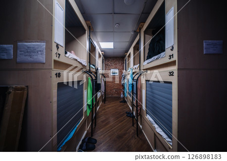 Capsule hotel offering comfortable and affordable sleeping pods 126898183