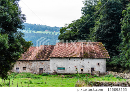Charming stone farmhouse with tile roof nestled in the Saja River Valley, Cantabria. 126898263
