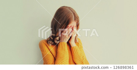 Upset sad crying woman while experiencing mental suffering, depression, fatigue, emotional stress Upset sad crying woman while experiencing mental suffering, depression, fatigue, emotional stress 126898361
