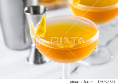 Paper plane cocktail on white marble 126898784