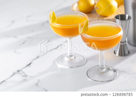 Paper plane cocktail on white marble. Copy space 126898785