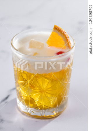 Classic cocktail whiskey sour on white marble background Classic cocktail whiskey sour on white marble background 126898792