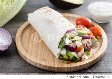 A delicious grilled chicken wrap A delicious grilled chicken wrap 126898805