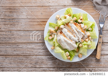 Crunchy Caesar salad with chicken Crunchy Caesar salad with chicken 126898811