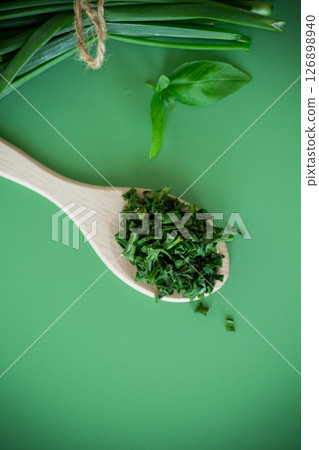 Top view of dried herbs and fresh green onions Top view of dried herbs and fresh green onions 126898940