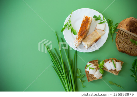 Simple village treat with rye bread, lard and onions 126898979