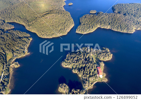 Beautiful blue water and green forest. 126899052