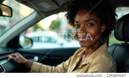 portrait of an adult smiling African woman with curly hair sitting in the passenger seat of a taxi. City street visible in the background portrait of an adult smiling African woman with curly hair sitting in the passenger seat of a taxi. City street visible in the background 126900007