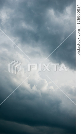 Gray contrasting fluffy storm clouds 126900084