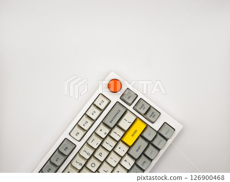 White keyboard on white background with bright red and yellow keys for advertising, space for text, top view 126900468