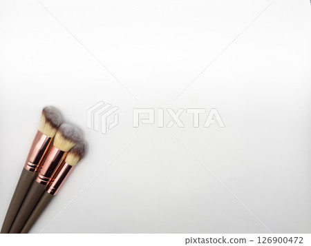 Three makeup brushes mermaid tail on a bright white background. copy space, flat lay, top view 126900472