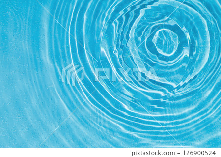 drops on water with circles on a blue background 126900524