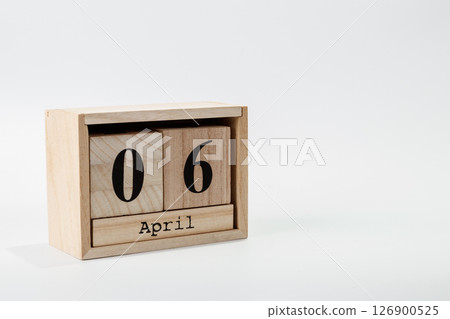 Wooden calendar April 06 on a white background 126900525