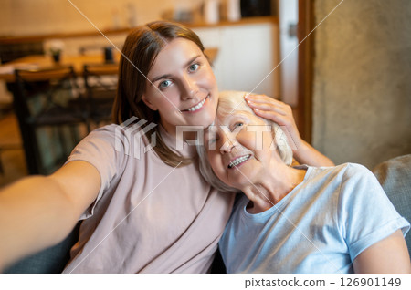 Young nurse making selfie with an elderly woman and both feeling happy 126901149
