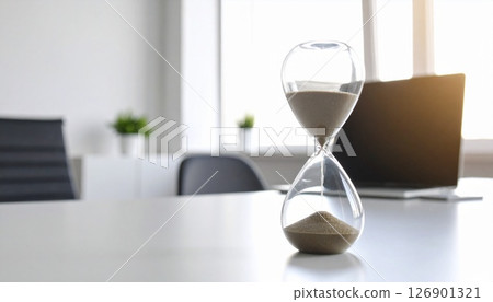 An hourglass just before the sand runs out 126901321