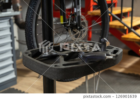 Side angle of bicycle wheel on repair stand Side angle of bicycle wheel on repair stand 126901639
