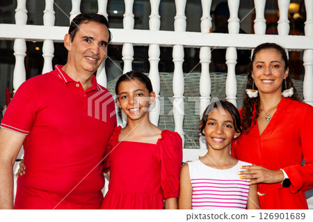 Young family of four traveling together. Family love concept. Travel concept. Cartagena de Indias. Young family of four traveling together. Family love concept. Travel concept. Cartagena de Indias. 126901689
