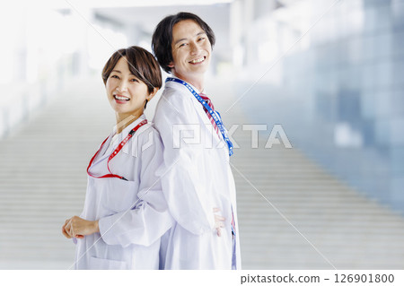 Male and female doctors working in a hospital Male and female doctors working in a hospital 126901800