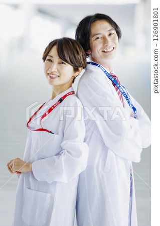 Male and female doctors working in a hospital Male and female doctors working in a hospital 126901801