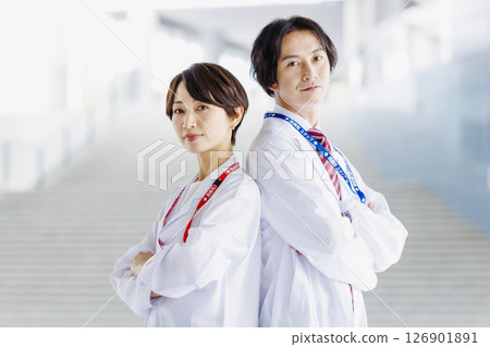 Male and female doctors working in a hospital Male and female doctors working in a hospital 126901891
