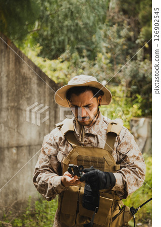Soldier Looking At The Compass To Find The Way Soldier Looking At The Compass To Find The Way 126902545