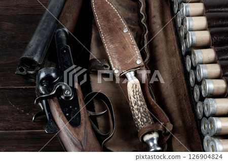 double barreled shotgun with cartridges in bandolier. 126904824