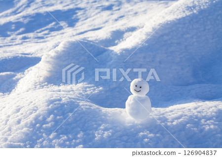 A snowman on a snowy field A snowman on a snowy field 126904837