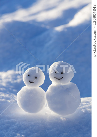 A snowman on a snowy field A snowman on a snowy field 126904848