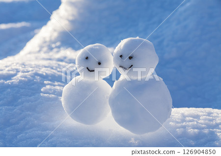 A snowman on a snowy field A snowman on a snowy field 126904850