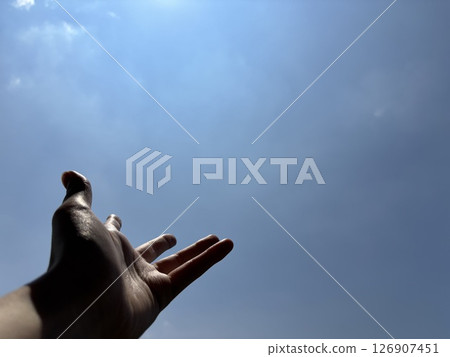 Hands extending into the sky 126907451