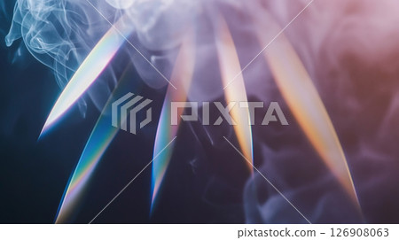 Colorful light spectrum refraction through smoke in abstract dark background 126908063