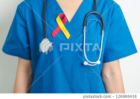 World hepatitis day awareness month, 28 July. Doctor holding Red and Yellow ribbon. Liver cancer, Jaundice, Cirrhosis, Failure, Enlarged, Hepatic Encephalopathy and Health concept 126908438