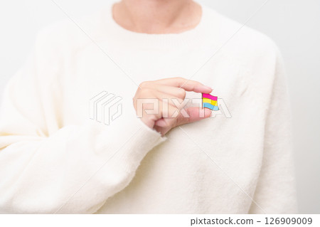Pansexual Visibility Day and Panromantic May Awareness Day and LGBT pride month concept. hand holding pink, yellow and blue heart shape for Lesbian, Gay, Bisexual, Transgender and Marriage Equality Pansexual Visibility Day and Panromantic May Awareness Day and LGBT pride month concept. hand holding pink, yellow and blue heart shape for Lesbian, Gay, Bisexual, Transgender and Marriage Equality 126909009