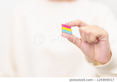 Pansexual Visibility Day and Panromantic May Awareness Day and LGBT pride month concept. hand holding pink, yellow and blue heart shape for Lesbian, Gay, Bisexual, Transgender and Marriage Equality 126909017