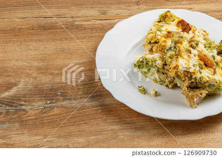 Delicious chicken fillet casserole with egg, broccoli, and garlic Delicious chicken fillet casserole with egg, broccoli, and garlic 126909730