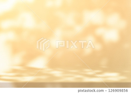 Gold Stucco Table with Nature Shadow on Concrete Wall Texture Background with Light Leak 126909856