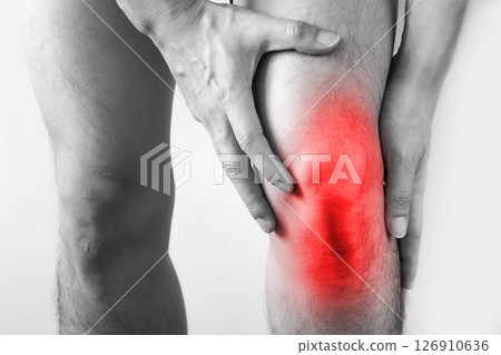 Knee pain .man standing caught his knee. health concepts Knee pain .man standing caught his knee. health concepts 126910636