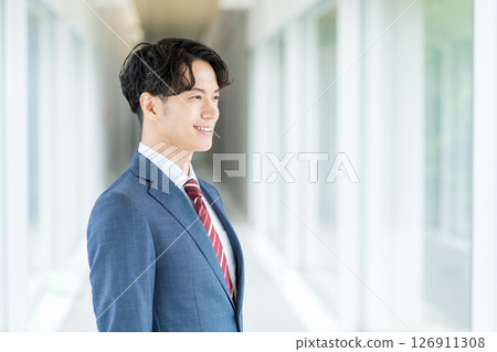 Businessman standing in the aisle. 126911308