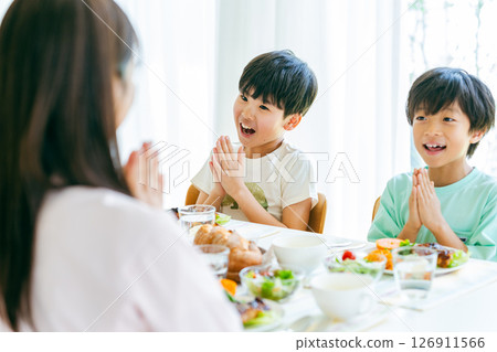 Family to dine at the dining room Family to dine at the dining room 126911566