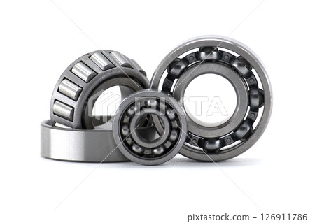 Collection of various ball bearings and roller bearings, isolated on a plain white background. Collection of various ball bearings and roller bearings, isolated on a plain white background. 126911786