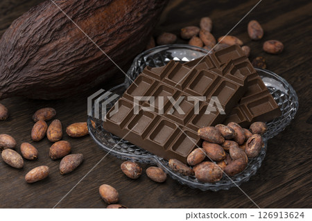Cocoa pods and cocoa beans and chocolate 126913624