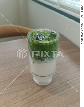 top view matcha green tea in a clear glass on a table background, drink, health, fresh, cool, copy space top view matcha green tea in a clear glass on a table background, drink, health, fresh, cool, copy space 126913825