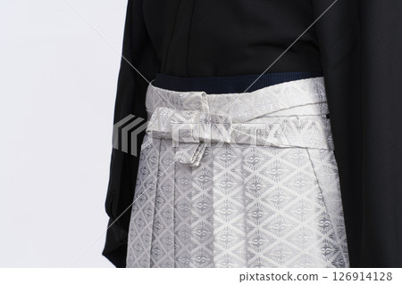 Steps for putting on a men's crested hakama: Dressing a man's hakama using a torso Steps for putting on a men's crested hakama: Dressing a man's hakama using a torso 126914128