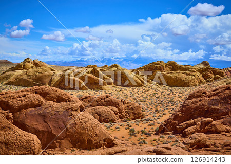 Majestic Sandstone Formations and Snowy Peaks in Valley of Fire Eye-Level View Majestic Sandstone Formations and Snowy Peaks in Valley of Fire Eye-Level View 126914243