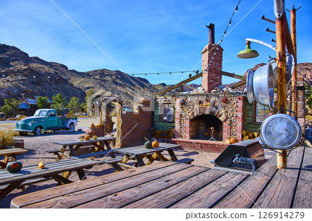 Vintage Turquoise Stone Fireplace in Rustic Desert Setting Eye-Level View 126914279